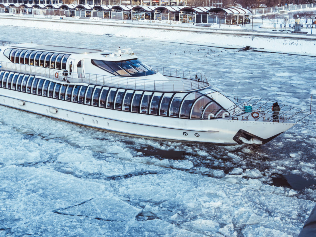 winter street ship on the frozen river